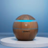 Devanti Ultrasonic Aroma Diffuser In Dark Wood Grain Finish On A Tabletop