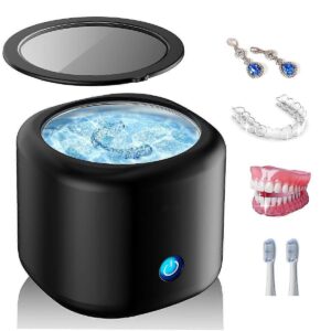 Matte black mini ultrasonic jewelry and denture cleaner with lid closed
