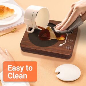 Scented Jar Candle Being Heated On A Gravity-Sensing Candle Warmer Plate