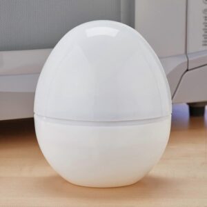 Compact microwave egg cooker shaped like a white egg with an internal aluminum plate