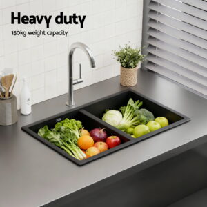 Smooth R10 Rounded Corners And Waste Strainer Inside A Black Granite Sink Bowl