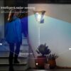 Solar motion sensor wall lights 2-pack mounted on an exterior garage wall