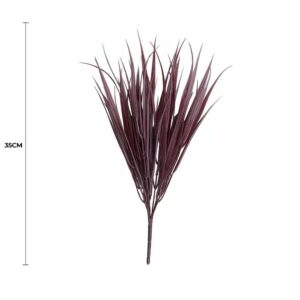 Several Dark Red Artificial Grass Stems Styled Elegantly Inside A Modern Ceramic Vase On A Console Table.