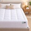 White quilted mattress topper, soft polyester, for enhanced bed comfort and protection.