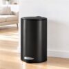 Matte black stainless steel round pedal trash can with brushed silver foot pedal for kitchen or office.