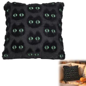 Black plush Halloween throw pillow with glowing green cat eyes pattern, for spooky home decor.