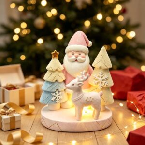 Pink Santa, reindeer, and trees LED Christmas decoration, resin, pastel colors, for festive home decor.