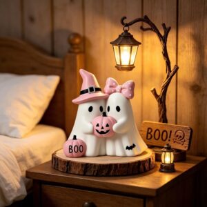 Cute resin ghost couple figurine with pink witch hat, bow, and pumpkins, on a wooden base with a lantern, for Halloween