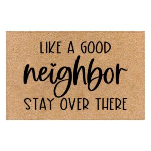 Tan coir doormat with "LIKE A GOOD neighbor STAY OVER THERE" in black text, for home entryways.