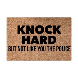 Brown coir doormat with "KNOCK HARD BUT NOT LIKE YOU THE POLICE" in black text, for home entryways.