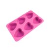 Pink silicone heart-shaped baking mold with 6 cavities for cakes, chocolates, or soap making.