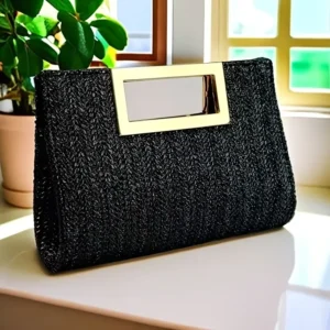 Black woven straw clutch bag with gold and silver metal clasp, for evening or formal wear.