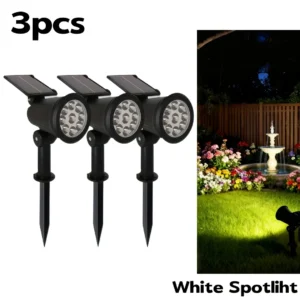 3pcs black plastic solar-powered LED spotlights with ground stakes, for outdoor garden and landscape lighting.