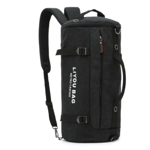 Black Canvas Duffel Bag With Backpack Straps, Side Handle, And Front Zipper Pocket For Travel Or Gym.