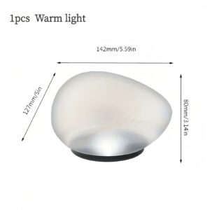 Warm light, egg-shaped frosted glass lamp with black base, for ambient lighting.