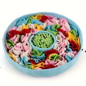 Round blue felt snuffle mat with colorful fabric strips and green rubber center for dog enrichment.