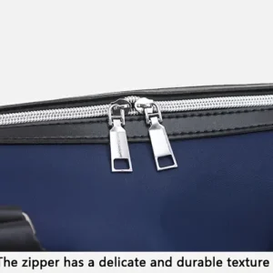 Navy Blue Nylon Duffel Bag With Black Leather Trim, Silver Metal Zipper Pulls, And Durable Texture For Travel.