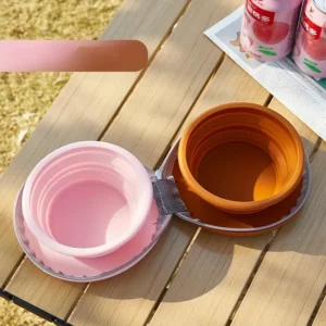 Collapsible silicone pet bowls, pink and brown, for portable outdoor feeding and watering.