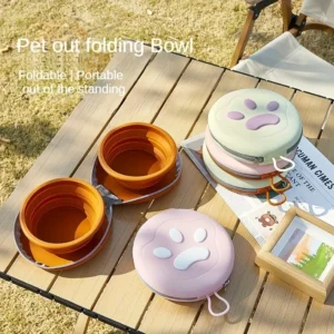 Portable Silicone Pet Folding Bowls In Orange, Pink, And Green With Paw Print Lids, For Travel Feeding.