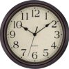 Round vintage-style wall clock with dark bronze plastic frame, cream face, and black Arabic numerals for home decor.