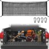 Black honeycomb mesh cargo net with carabiners for truck bed organization.