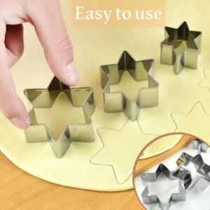 5-Piece Star Cookie Cutter Set | Stainless Steel – Sumo Deals Silver Stainless Steel Star-Shaped Cookie Cutters Pressing Into Yellow Dough For Baking.