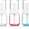 Set of 3 clear, pink, and blue plastic spray bottles with white pumps and caps for travel toiletries.