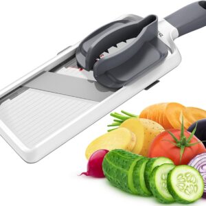 White & gray plastic mandoline slicer with safety holder, for slicing vegetables like cucumbers, potatoes, and carrots.