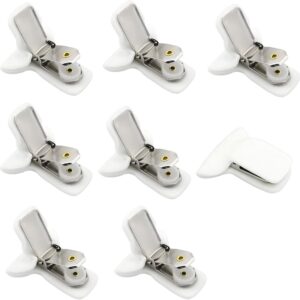 White plastic and metal sheet clips with gold rivets, for securing bed sheets and tablecloths.