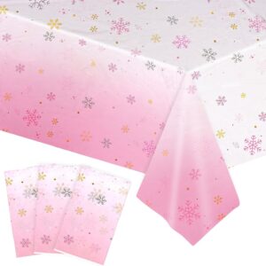 Pink ombre snowflake plastic tablecloth & napkins for winter wonderland party decor.