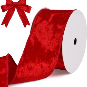 Red velvet wired ribbon on a spool, with a pre-tied bow, for gift wrapping, crafts, or holiday decor.