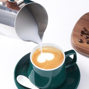Milk Frothing Pitcher 350Ml With Latte Art Pen – Sumo Deals Stainless Steel Milk Frothing Pitcher Pouring Milk Into A Dark Green Ceramic Coffee Cup With Latte Art.