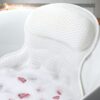 White mesh bath pillow and mat set for comfortable bathing, featuring a textured surface and integrated headrest.