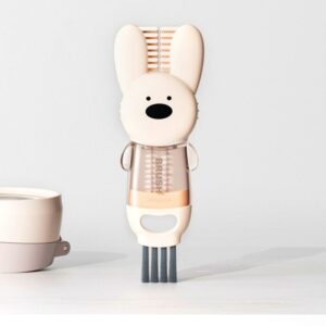 Cute bunny-shaped plastic keyboard brush cleaner with comb, beige and transparent, for desk and gadget cleaning.