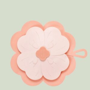 Pink flower-shaped silicone floor drain cover with "FLOOR DRAIN" text, for bathroom or kitchen.