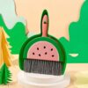 Cute watermelon-themed plastic mini dustpan and brush set, green and pink, for desk or small cleanups.