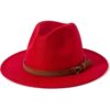 Red felt fedora hat with wide brim, pinched crown, and brown faux leather band with tassel detail for fashion.