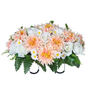 Artificial cemetery saddle arrangement with peach mums, white roses, and daisies, green ferns for grave decoration.