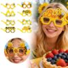 Yellow paper bee-themed party glasses with various designs for kids' birthdays or summer events.