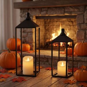 Black metal open-frame decorative lanterns with LED pillar candles, for indoor/outdoor fall decor.