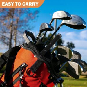 Orange nylon golf club bag with black trim, multiple pockets, and shoulder strap, holding various metal golf clubs.