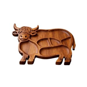Brown wooden cow-shaped serving tray with multiple compartments for snacks or charcuterie.