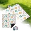 White quilted waterproof picnic blanket with colorful papaya fruit print, foldable for outdoor use.