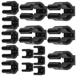 Black plastic broom/mop holder clips, wall-mounted for garage/utility room organization.