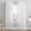 White sheer linen curtain panels on a rod, light filtering window treatment for living room.