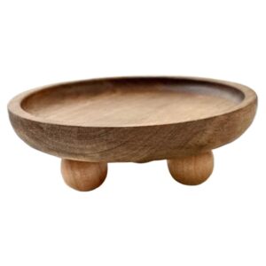 Round, light brown wooden display tray with three spherical feet, for home decor, plants, or small items.