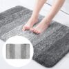 Shaggy microfiber bath mat, striped gray gradient, soft absorbent rug for bathroom floor.