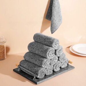 Rolled grey microfiber cleaning cloths stacked on a dark marble tray with gold handles, for kitchen or bathroom.