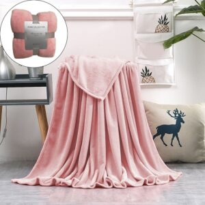 Soft pink fleece throw blanket, plush and cozy, for sofa or bed decor.