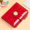 Red patent leather RFID-protected women's wallet with embossed circles, gold snap closure, and zipper for daily use.